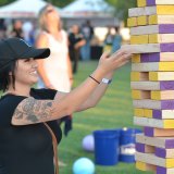 A visitor plays one of many games on hand.